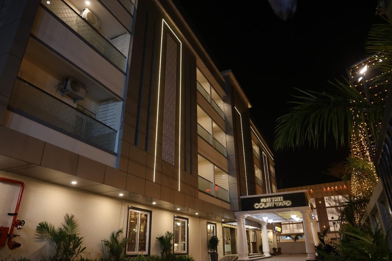 Guest accommodation wing of the property illuminated at night