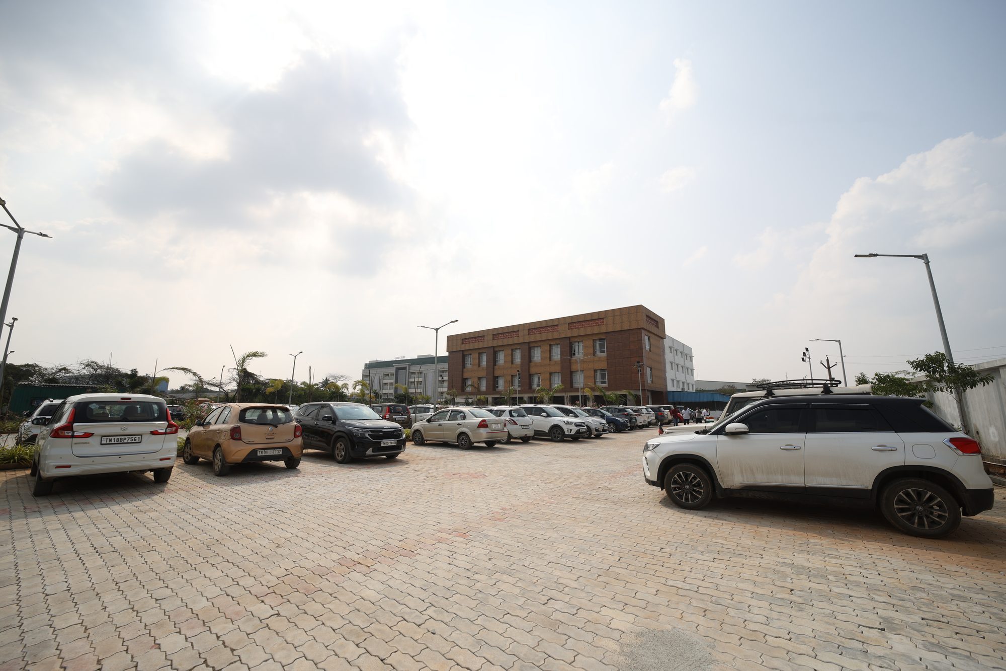 Spacious paved parking forecourt in front of the building