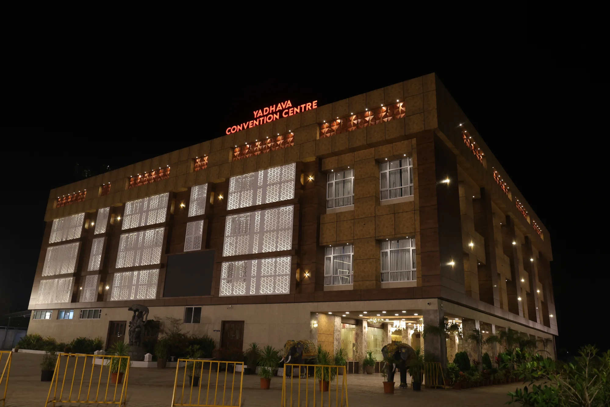 Yadhava Convention Centre illuminated at night